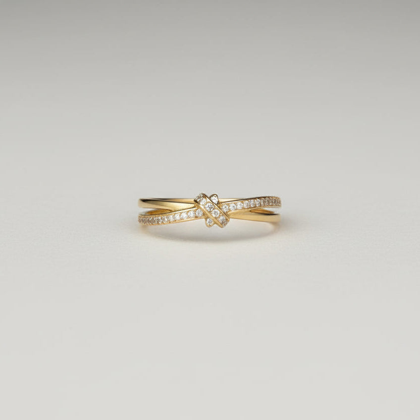 Hand wearing a gold ring with a white background