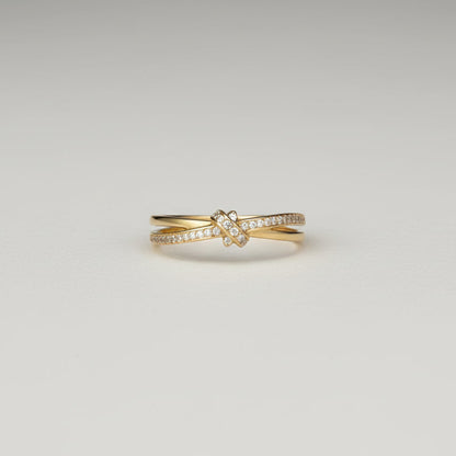 Hand wearing a gold ring with a white background