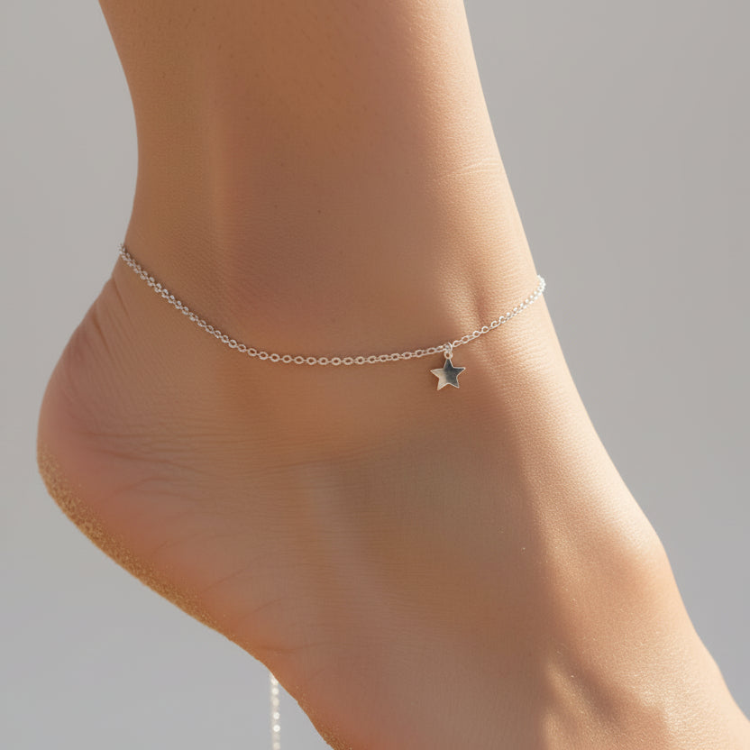 Silver star anklet on a person's ankle with 'bamoer' branding.